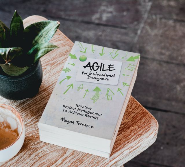 The Agile for Instructional Designers book on a table.