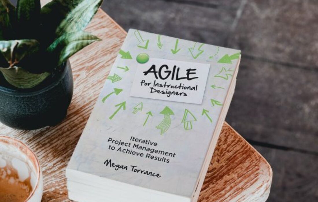 The Agile for Instructional Designers book on a table.